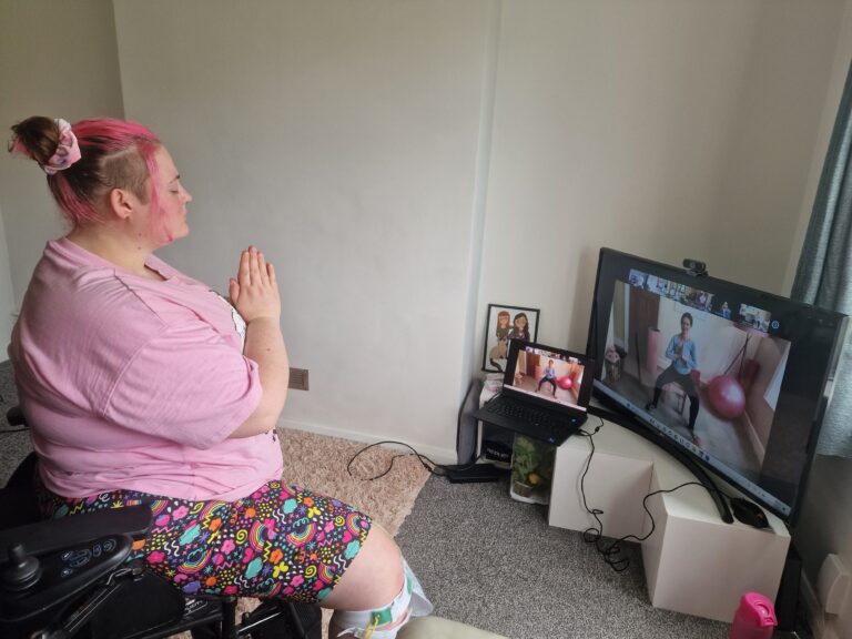 a mobilates member enjoying an online pilates class